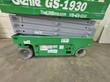 Genie GS-1930 chassis side with gray scissor stack, solid tires and battery tray decals