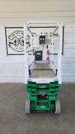 JLG 1930ES scissor lift stowed, end view of the platform entry, control box, fire extinguisher and diamond-plate deck