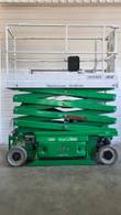 JLG 2632ES electric scissor lift with the scissor stack partly raised, side view
