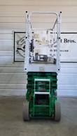JLG 2632ES scissor lift, stowed, entry end with ladder, platform controls and amber beacon