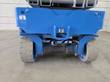 Genie GS-1930 rear chassis with dual drive motors, hydraulic hoses, tie-down points and gray tires