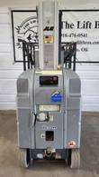 JLG 20MVL mast lift power unit end: control panel, charger port and data plate on the mast