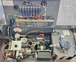 Skyjack S3219 power bay: relay and terminal wiring, hydraulic pump motor, valve manifold and reservoir