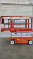 Orange and white Snorkel S3219E electric scissor lift, stowed, opposite side view