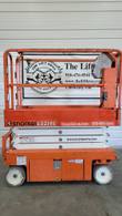 Snorkel S3219E electric scissor lift, stowed, with platform control box and model decal visible
