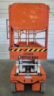 Orange Snorkel S3219E electric scissor lift, stowed, rear view with Snorkel logo on the platform and backrest