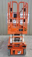 Snorkel S3226E scissor lift, front end view with fold-down platform rails