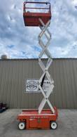 Snorkel S3219E electric scissor lift, platform raised to full height, scissor stack fully extended
