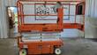 Snorkel S3219E scissor lift, stowed, with the platform extension deck slid out