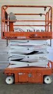 Snorkel S3219E electric scissor lift with the scissor stack partly raised, front view