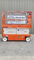 Snorkel S3226E scissor lift, stowed, opposite side view with platform rails