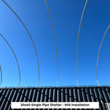 Bare galvanized arch ribs against blue sky above a dark container, captioned 20x40 single pipe shelter installation