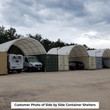 Customer photo of side-by-side white container shelters with vans and SUVs parked under the arched roofs