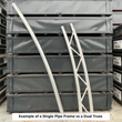 Galvanized single pipe arch next to a dual truss arch, comparing the two frame types