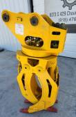 Yellow ALS1638 rotating grapple, pin-on mount head and rotator bearing above the open yellow tines