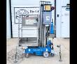 Blue Genie AWP-25S push-around lift: steel platform with guardrails, aluminum mast, casters and four leveling outriggers