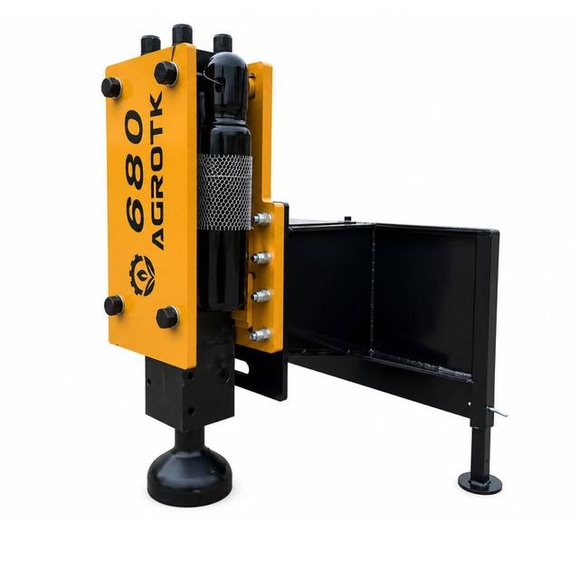 AGROTK 680 post driver: yellow guard panel over the black hammer cylinder, cupped post cap, quick-attach frame