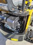 AGT QH12R engine compartment: air cleaner, muffler with HOT decal and throttle cable beside the rubber track
