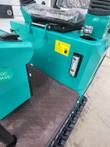 AGT MH12RX hydraulic oil tank with fill cap, level gauge and warning label behind the operator seat