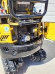 FF15 rear engine bay open: Briggs & Stratton OHV engine with air cleaner and muffler, EPA label, final drive and tracks