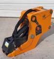 Orange Wolverine hydraulic clamp attachment with cylinder, coiled hoses, lift eye and mounting pins