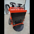 AGT LRT23 mini skid steer from behind: red frame, black engine cover, gauge panel and diamond-plate stand-on platform