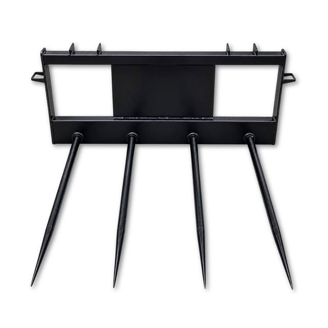 JCT four-spear hay bale spear, black frame with four forged tapered tines and a universal skid steer quick-attach mount