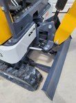 ME20 mini excavator's front push blade, its lift cylinder and linkage, with the rubber track and white lower body