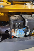 AGT MX12R mini excavator engine bay: OHV gasoline engine with shielded muffler, air cleaner and hydraulic pump