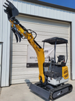 IRE18P mini excavator with boom raised high, toothed bucket and open hydraulic thumb above the dozer blade