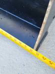 Tape measure along the bucket's cutting edge to the side plate, reading 32 inches
