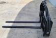 60-inch hydraulic pallet forks at an angle: slotted backrest, long fork bars and coiled hose run