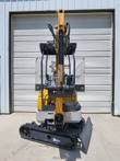 Yellow ME20 mini excavator with enclosed cab, track drive, and extendable boom arm