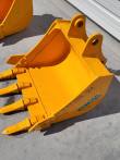 Yellow excavator bucket stamped CAT305 24 with a Future decal, four bolt-on teeth and twin pin bosses