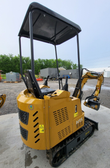 AGT H15 mini excavator from the rear: vented engine shroud with the H15 decal, black canopy, joysticks and rubber tracks