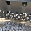 WIG asphalt block crusher discharge screen, crushed concrete passing through the bolted sizing slots