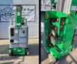 Green Genie GR-20 mast lift: gray battery cover at the front, and the side compartment open showing charger and controls