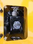 DM12-C fuel bay: black Briggs & Stratton tank and cap under the deck hatch, with the hydraulic filter and hose above