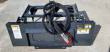 Back of the gray attachment: mount plate, coiled hydraulic hoses, red coupler and warning decals