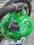 Top of the DB500 blast pot: abrasive fill port with hold-down cap, pressure gauge and air plumbing