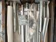Galvanized frame tubes, brackets, and bagged bolts packed in the front wall kit crate