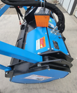 Blue 72-inch drum mulcher from above: hose couplers, data plate and the tool cases sitting on the deck