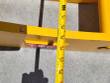 Tape measure across the yellow rake's frame beside the red TOFT badge, reading in the 39-inch range