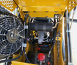 AGT MX-CRT23 engine bay with cooling fan, black muffler, hydraulic gear pump, battery and red fuel cap