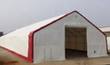 White PVC dual-truss fabric building with red trim, gable end and open end door