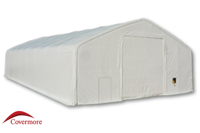 White 30oz PVC dual-truss fabric building, drive-through winch door and man door in the end wall