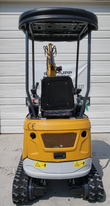 IRE18P rear engine hood with mesh grille and CE mark, canopy and operator seat above the tracks