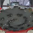 Disc mulcher cutter wheel face: bolt-on cutting teeth spread across the steel disc around a bolted center hub