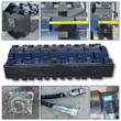 Padfoot vibratory roller with close-ups: welded drum pads with a tape measure, pillow block bearing, hydraulic couplers