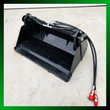 Black IRanch 4-in-1 bucket, clamp jaw open, hydraulic hoses looped to red-capped couplers